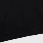 Close-up view of the premium black cotton hoodie from the Hellstar Sample Tracksuit with a spacious kangaroo pocket.