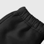 Close-up view of the adjustable drawstring waistband on black Hellstar Sample sweatpants, showcasing premium quality.