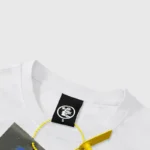Close-up view of the Hellstar Savior printed T-shirt white neck label with branding and sizing details.
