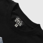 The Hellstar Saviors T-Shirt features an authentic branded neckline tag showcasing the official Hellstar logo design.
