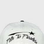 Hellstar Shark Teeth snapback hat in off-white and black with embroidered Path to Paradise text and star logo.