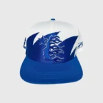 Hellstar Shark Teeth Snapback hat in off-white and royal blue featuring an aggressive embroidered streetwear graphic.