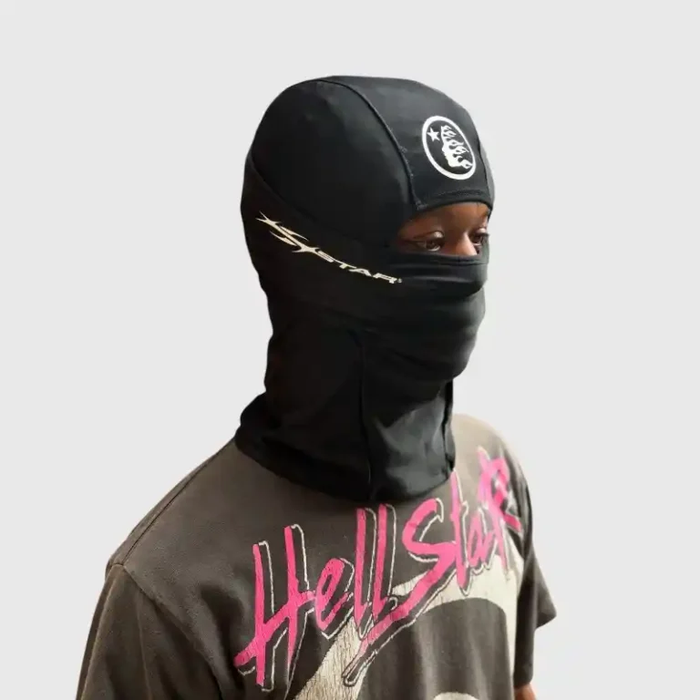 Model wearing a black Hellstar Shiesty Balaclava ski mask with white logo branding, showing a sleek winter accessory.