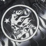 Close-up view of the Hellstar Skull Drop graphic print on a black mesh long sleeve streetwear tee shirt.
