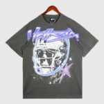 Dark grey vintage wash Hellstar T-shirt featuring a skull wearing a football helmet graphic and purple star print.