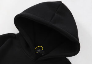 Close-up view of the black Hellstar Smiley World hoodie featuring a detailed hood and internal size tag label.