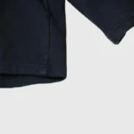 Close-up view of the premium fabric and hem detail on the black Hellstar Snap Shorts for a stylish urban streetwear look.