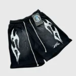 These black Hellstar snap shorts feature a striking white graphic screen print and comfortable vintage-washed fabric.