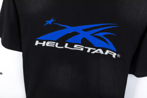 Close-up view of the bold blue Hellstar Sport logo printed on a high-quality black cotton t-shirt for streetwear fans.