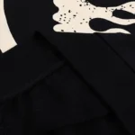 Close-up of the Hellstar Sport Gel Logo Tracksuit featuring high-quality black fabric and distinctive brand graphics.
