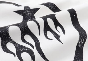 Close-up of the black flame and star graphic printed on the white Hellstar Sport hoodie fabric design.