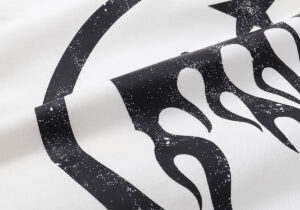 Close-up view of the black graphic screen print featuring flames and stars on a white Hellstar Sport Hoodie.