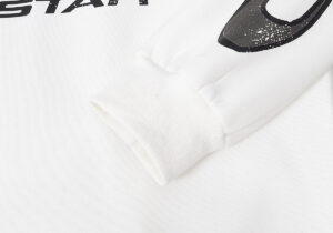 Close-up view of the sleeve detail on the premium white Hellstar Sport Hoodie, featuring signature graphic branding.