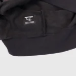 Close-up view of the interior neck brand label on the black Hellstar Sport Logo fleece hoodie garment.