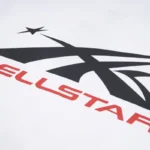 Close-up view of the iconic black and red Hellstar Sport logo printed on a white premium cotton graphic sweatshirt.