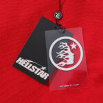 Official Hellstar Sport Pullover Hoodie authentication tag featuring the brand logo on black and transparent hangtags