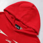 Detail of the Hellstar Sport Pullover Hoodie in red showing the authentic inner neck branding and collar label.