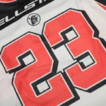 Hellstar Sport Style Long Sleeve Tee featuring a white mesh fabric with a large red number 23 graphic and logo.