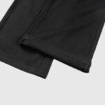Close-up view of the ribbed cuff and hem detail on the black Hellstar Sports sweatpants made of premium fleece fabric.