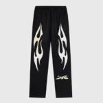 Black Hellstar Sports sweatpants with white flame graphics and signature logo branding on the front.