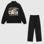 The black Hellstar Sports tracksuit, featuring a long-sleeve shirt with a flaming skull graphic and matching pants.