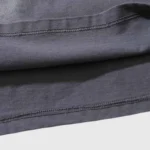 Close-up view of the premium fabric texture and durable stitching on the Hellstar Sports Core Logo Gel T-Shirt.