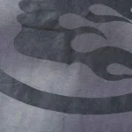 Close-up view of the premium dark grey performance fabric and the tactile gel-printed logo on the Hellstar sports t-shirt