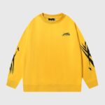 Hellstar Sports Crewneck Sweater in vibrant yellow with black sleeve graphic prints and chest logo detailing.