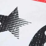 Close-up view of the black and white graphic screen print on the Hellstar Sports Family T-shirt showing star details.