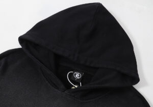 Close-up view of the interior neck tag on the Hellstar Sports Future Flame Flare black cotton fleece hoodie.