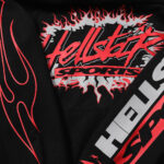 Close-up of the black Hellstar Sports Future Flame hoodie featuring vibrant red flame graphics and logo branding.