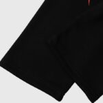 Detail view of the Hellstar Sports Future Flame Tracksuit in black, featuring premium fabric and stitching.