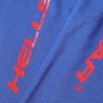 Close-up of the Hellstar Sports blue fabric featuring a bold red gel logo graphic detail for premium streetwear.