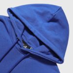 Close-up view of the hood detail on the blue Hellstar Sports Gel Hoodie with drawstring closure features.