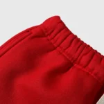 Close-up of the red elastic drawstring waistband on the Hellstar Sports Gel sweatpants for a secure athletic fit.