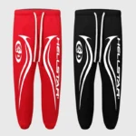 Red and black Hellstar sweatpants with white drawstrings and white graphic prints down the legs