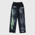 Hellstar Sports Graphic Print Sweatpants in black featuring bold green text and athletic flame graphics, front view.