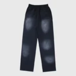 Black Hellstar Sports graphic print tracksuit pants featuring a faded vintage effect and comfortable elastic waist.