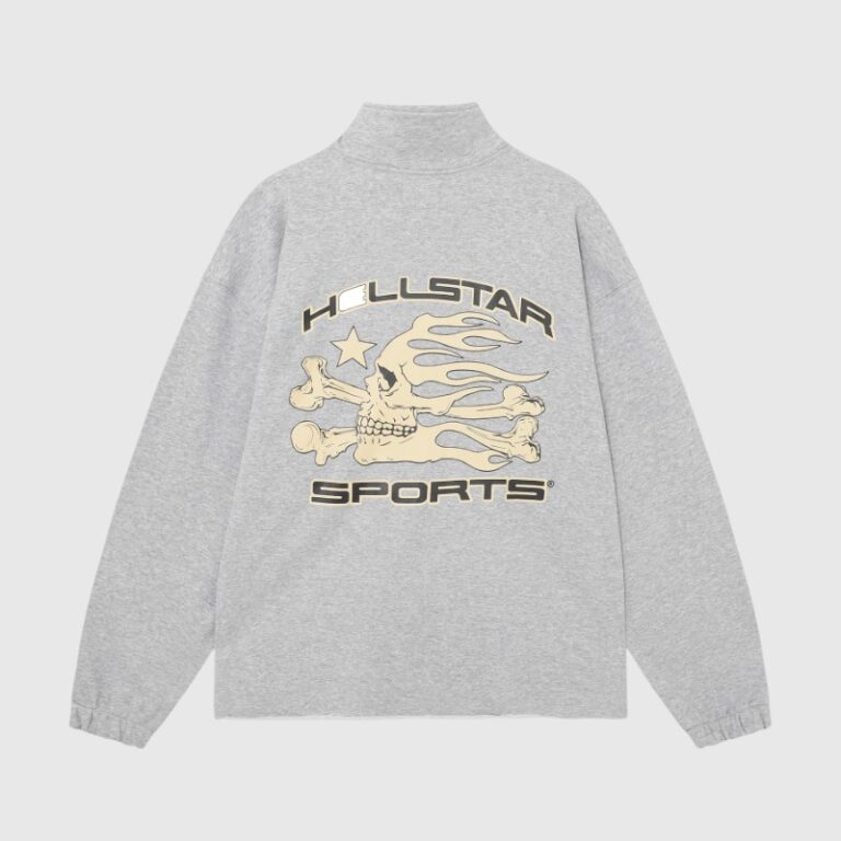 Hellstar Sports grey sweatshirt featuring a vintage washed fabric, ribbed cuffs, and a bold flaming skull graphic print.