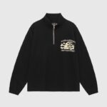 Front view of a black Hellstar Sports quarter zip sweatshirt with a graphic skull logo and flame detailing on the chest.