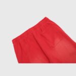 Close-up back view of Hellstar Sports red sweatpants showing the elastic waistband and patch pocket detail.