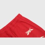 Close-up of the Hellstar Sports red sweatpants featuring a comfortable elastic drawstring waistband construction.