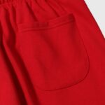 Close-up view of the premium red fabric and pocket detail of the Hellstar Sports tracksuit made from 100% cotton.