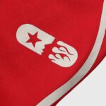 Close up of the Hellstar logo detail on the premium cotton fabric of the Hellstar Sports Red Tracksuit design.