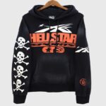 Hellstar Sports Skull Hoodie in black featuring bold orange graphics and a sleeve design with four white skull prints.