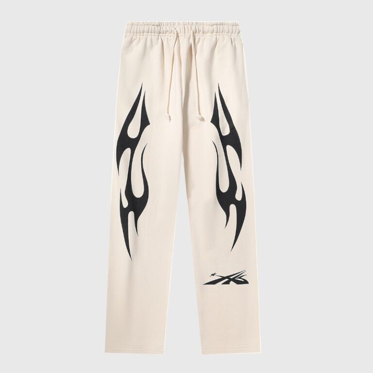 Beige Hellstar Sports sweatpants featuring a relaxed fleece fit, signature flame graphic screen print, and drawstring.
