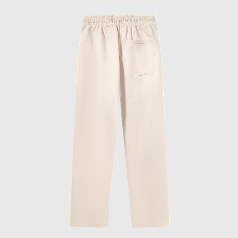 Back view of the Hellstar Sports beige fleece sweatpants with a relaxed fit and a rear patch pocket for streetwear.