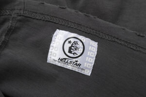 Close-up view of the Hellstar Sports Tee Shirt authentication tag featuring the brand logo on high-quality fabric.