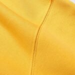 Close-up view of the high-quality yellow fabric texture from the premium Hellstar Sports Tracksuit collection.