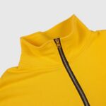 Close up view of the Hellstar Sports yellow half zip sweatshirt collar detail with a black zipper and metallic pull